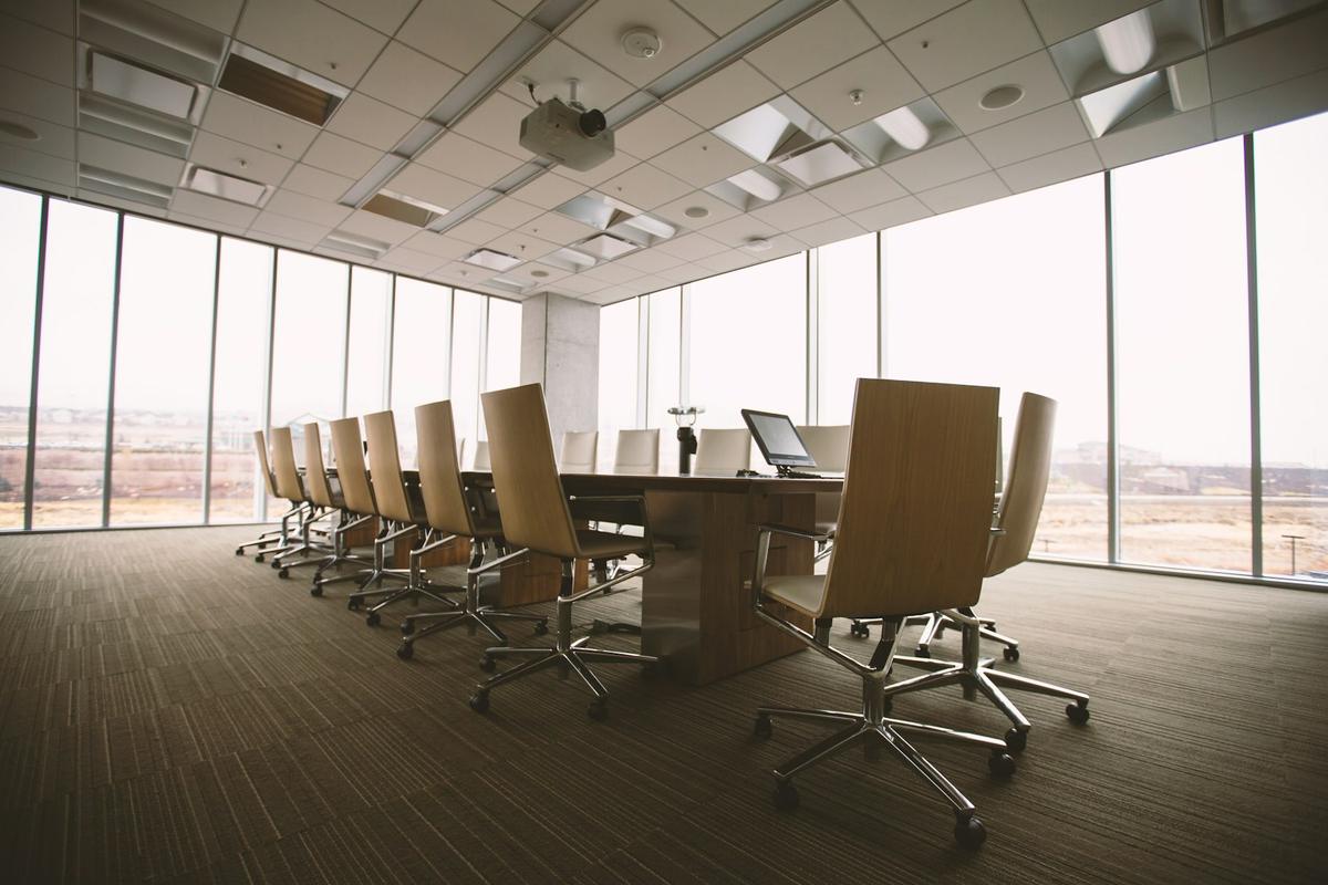 Empty boardroom with long conference table